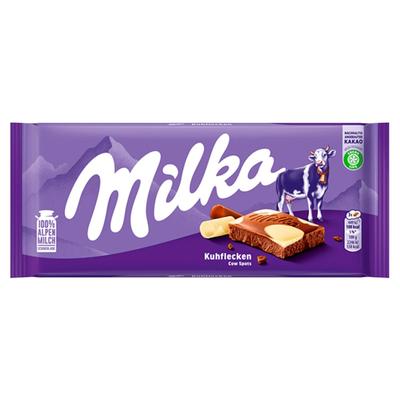 Milka Cow Spots alpesi tej felhasználásával készült tejcsokoládé fehér csokoládéval 100 g