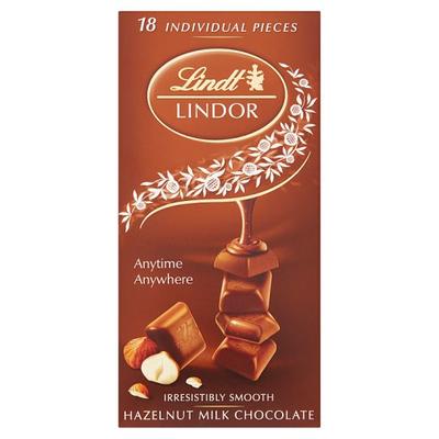 Lindt Lindor svájci tejcsokoládé mogyoródarabokkal és lágyan olvadó töltelékkel 100g